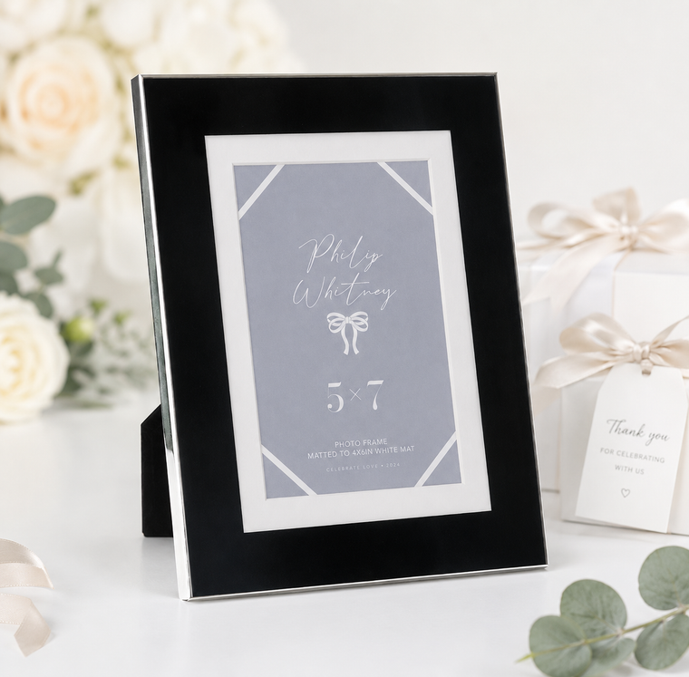 A 5x7 black alternative metal photo frame with a white mat and silver trim for wedding, engagement, bridal shower, and anniversary photos.