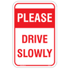 Please Drive Slowly Sign in a residential area