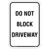 Bold Do Not Block Driveway Sign displayed prominently to deter parking in front of a residential driveway.