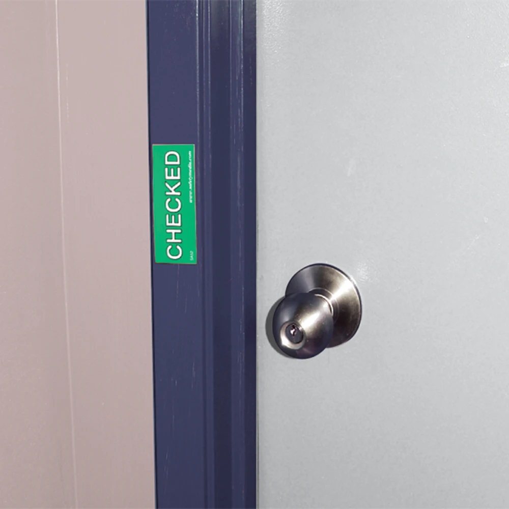 Magnetic evacuation door marker with bold “CHECKED” text for metal doors and frames
