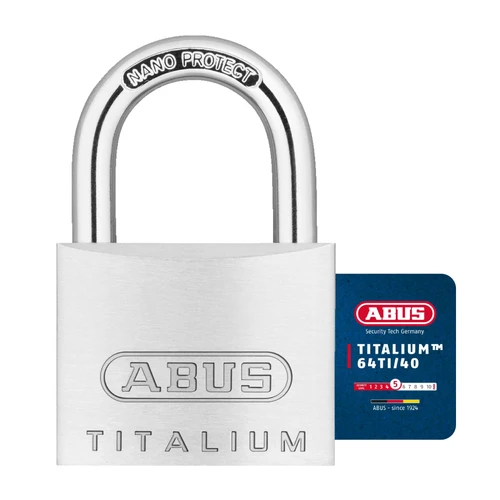 Padlock 64 TITALIUM with hardened steel shackle and tulip key on white background.