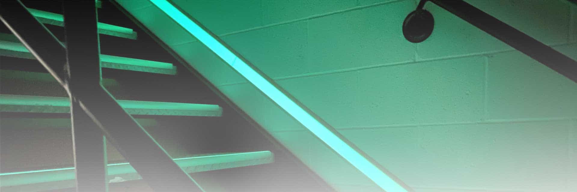 ecoglo banner image: stairwell with photoluminescent pathmarking tape 