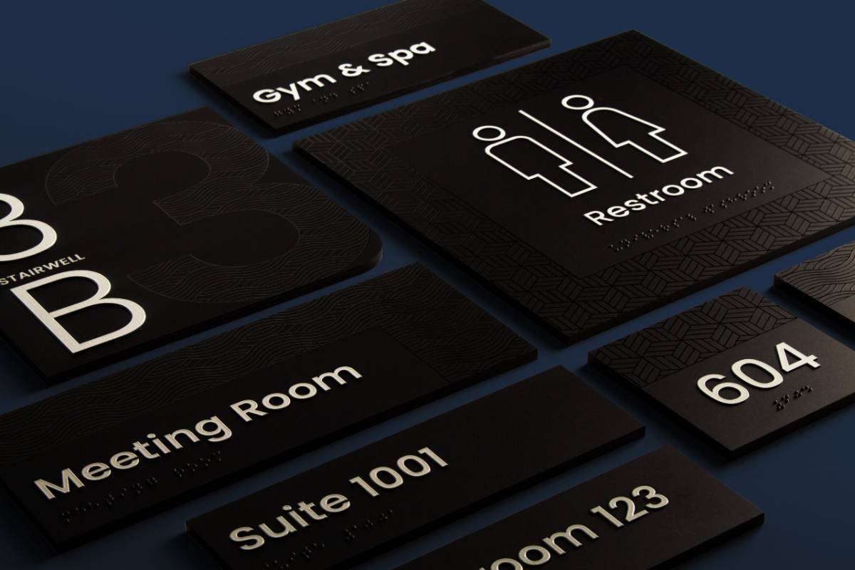 Singularum black room signs for a restroom, gym and spa, meeting room, suite 1001 and unit 604 on a navy background