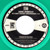 Gogol Bordello – We Comin' Rougher (Immigraniada) (2 track 7 inch single used US 2010 green vinyl NM/NM)