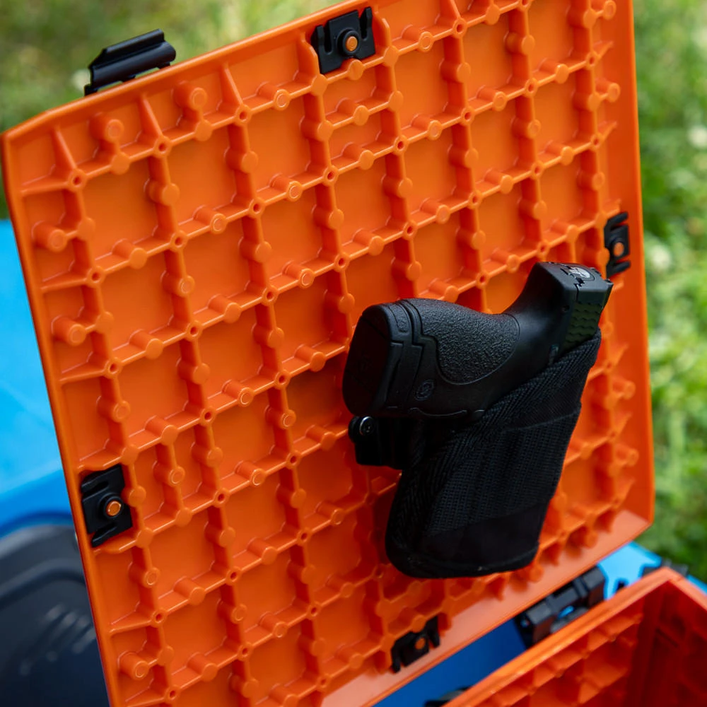 Angled view of the GridLoc Belt Loop Adapter being used on Orange BlackPak Pro