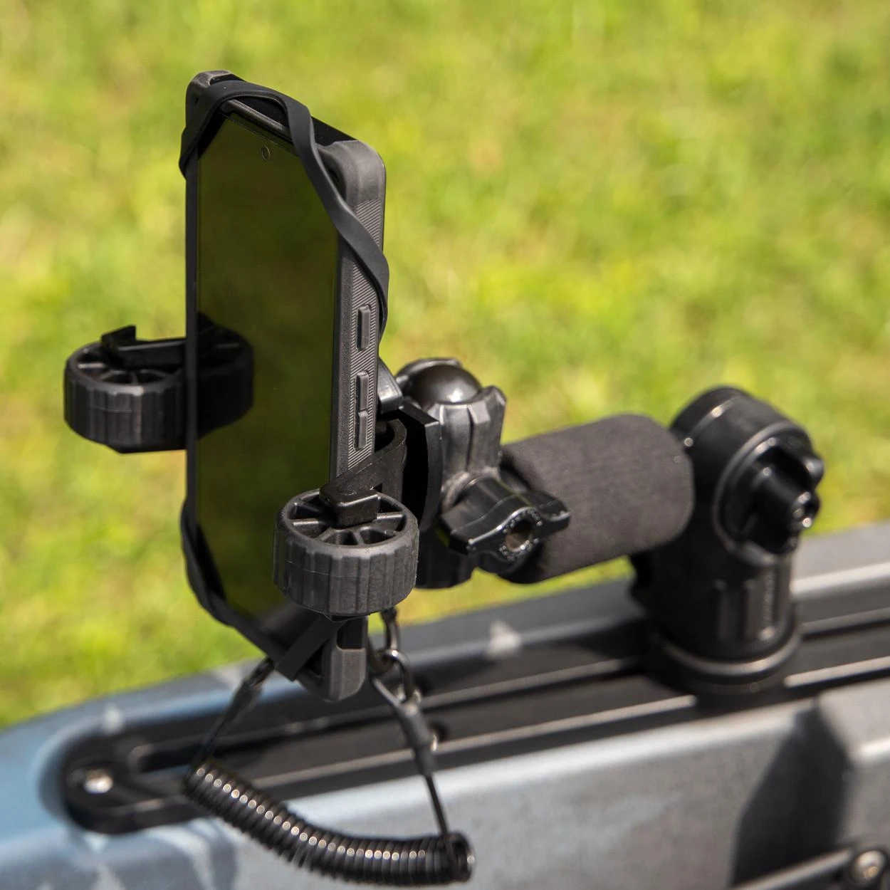 Side angled view of the RotoGrip Phone Holder Pro with LockNLoad Mounting System on a kayak