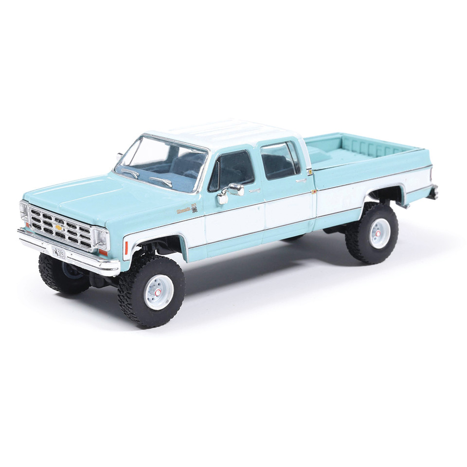 1978 Chevrolet Silverado K30 Crew Cab Fleetside Lifted - Light Blue and Frost White 1:64 Scale Diecast Model Truck by IXO Models Main Image