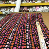 Pink and Orange Daisy Chain On Black | Lightweight Jersey Knit Stretch Fabric | Clothing and Apparel | By the Yard | 60 inch Wide