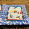 Pigs with Parachuttes Baby Quilt Panel | Primary Colors on Blue | 36 inch Panel | Juvenile Nursery Fabric | 44 Wide | 100% Cotton | By The Panel