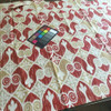 Ikat Scrollwork in Red, Beige, and White | Outdoor Upholstery Fabric | 54 Wide