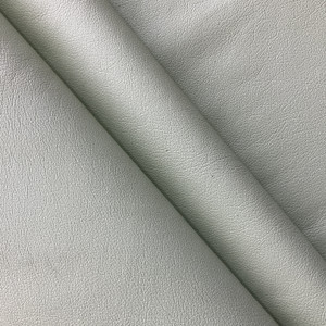 Castillo in Pistachio Green | Faux Leather Vinyl Upholstery Fabric | Light Grain | Workable | 54" Wide | By the Yard