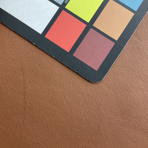 Edge in Brandy | Faux Leather Vinyl Upholstery Fabric | Light Grain | Solid Brown | 54" Wide | By the Yard