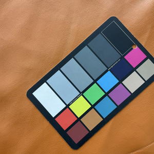 Pluto in Sherbet | Faux Leather Vinyl Upholstery Fabric | Light Pebbled Grain | Solid Orange Brown | Thin and workable | 54" Wide | By the Yard