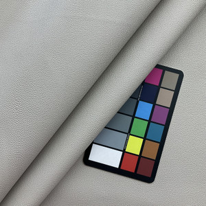 Patagonia in Arena | Light Beige Faux Leather | Vinyl Upholstery Fabric | Medium Pebbled Bubble Grain | Workable | 54" Wide | By the Yard