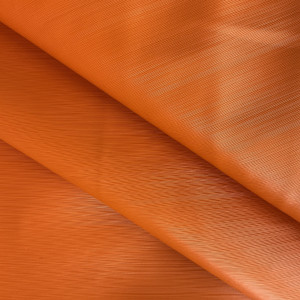 Lightspeed in Orange | Warm Orange Glossy Lined Texture Faux Leather Upholstery Vinyl Fabric | Midweight | Indoor Furniture | Felt Backed |  54 Wide | Sold BTY