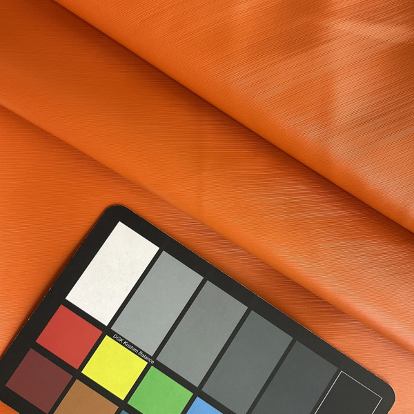 Lightspeed in Orange | Warm Orange Glossy Lined Texture Faux Leather Upholstery Vinyl Fabric | Midweight | Indoor Furniture | Felt Backed |  54 Wide | Sold BTY