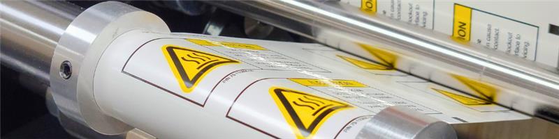 Roll of Polyester Safety Labels Being Printed