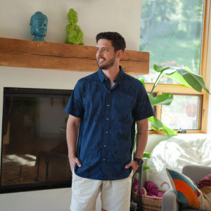 Man standing inside wearing Ethan Organic Cotton Shirt studio in navy blue