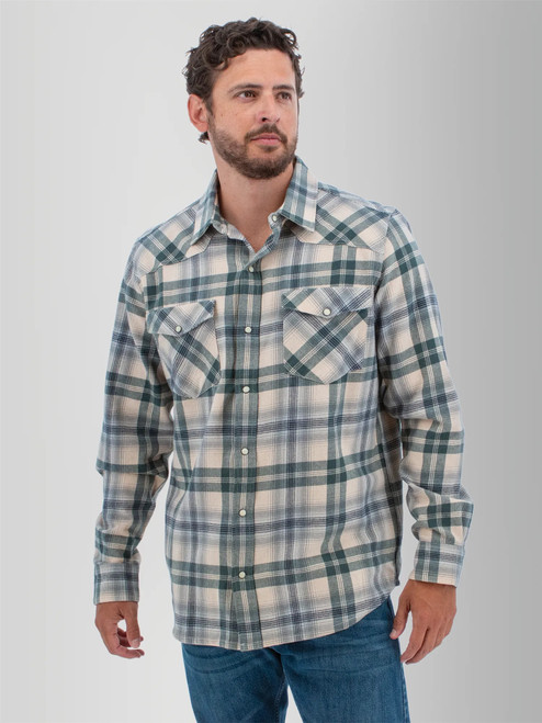 Man wearing the Ranger Western Style Pearl Snap Shirt in stormy weather blue plaid.