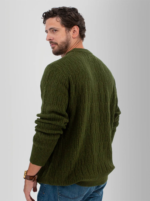Rear left shoulder view of the Wade Cable Knit Sweater in beetle green.