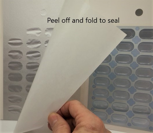 Load the tray, peel off the back and fold to seal.