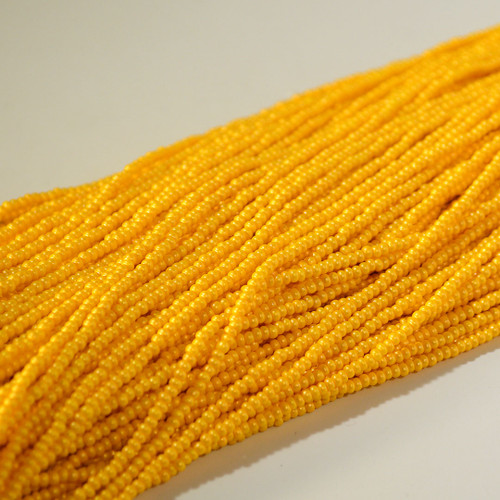 11/0 Permalux Dark Yellow Czech Seed Bead sold by the Hank