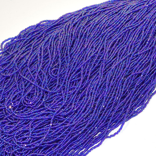 11/0 Blue Transparent Iris Charlotte Cut Czech Seed Bead sold by the hank. 