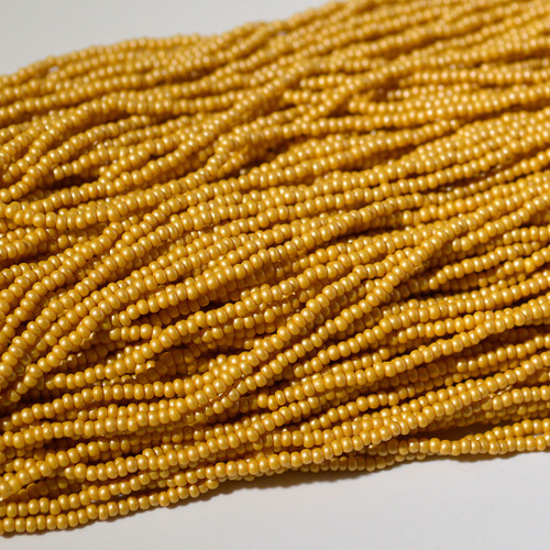 11/0 Permalux Yellow Brown Czech Seed Bead sold by the Hank