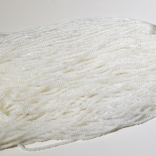 11/0 Opaque Pearl White Charlotte Cut Czech Seed Bead sold by the hank. 