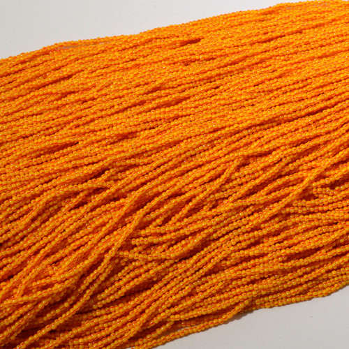 11/0 Orange and red stripe Czech Seed Bead sold by the Hank