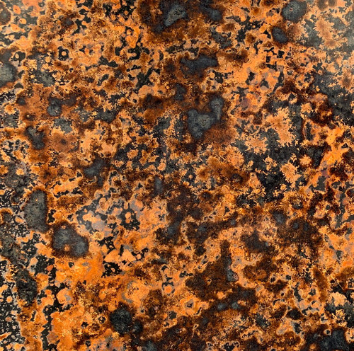 patina copper sheet with a black and brown mottled oxidation pattern