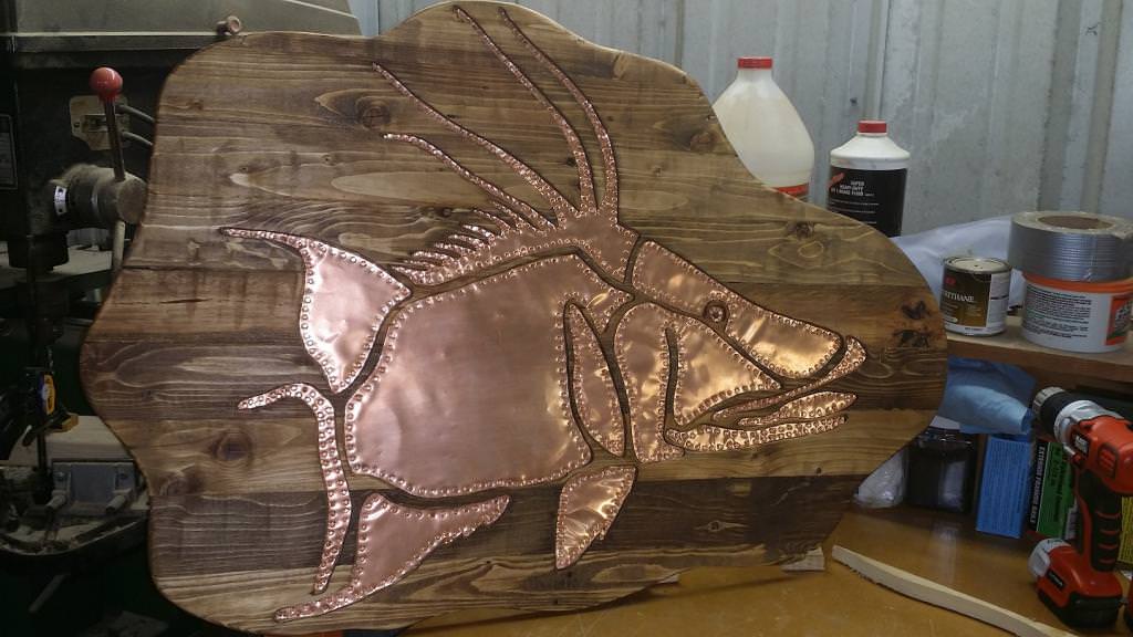 copper sculpture of a hog fish