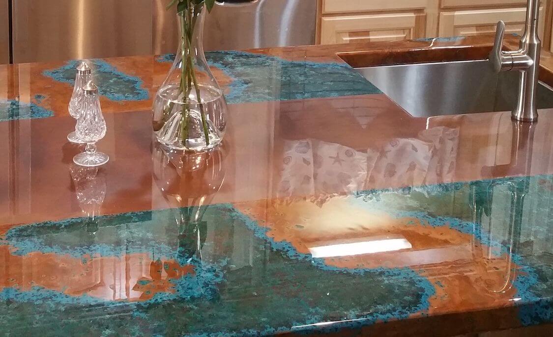 Azul and Rustic Copper Countertop and Backsplash 