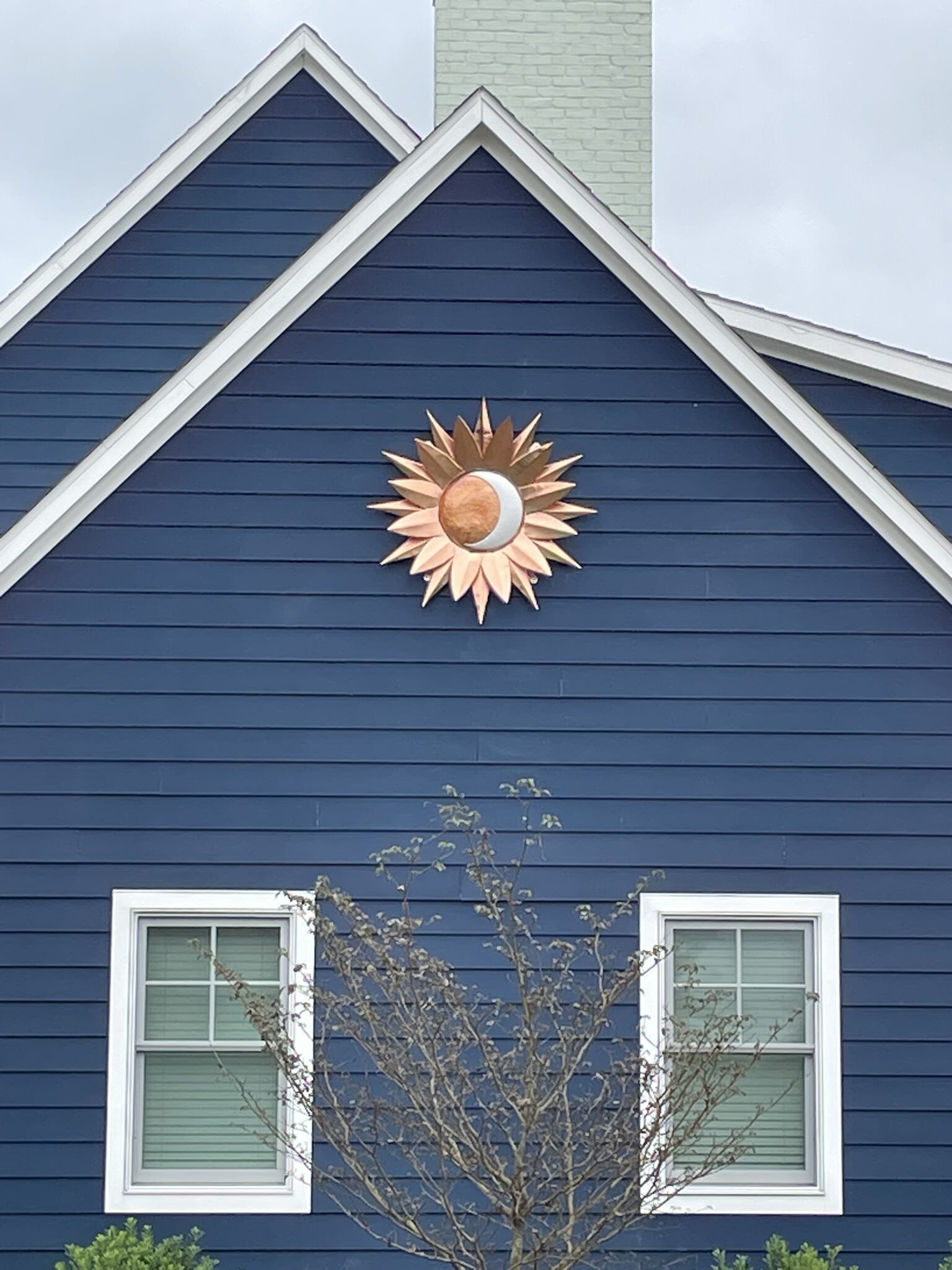 copper-sun-moon-on-gable.jpeg