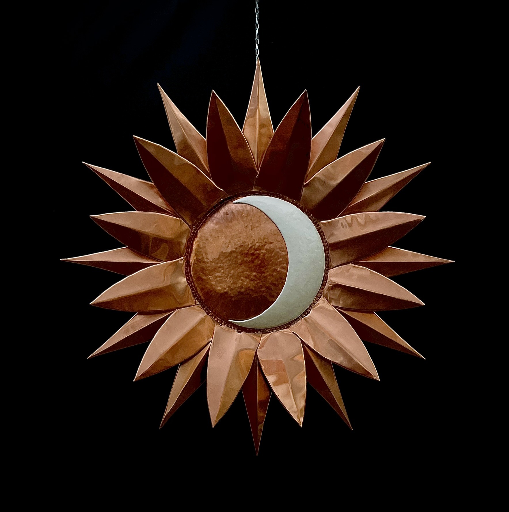 Sun and moon sculpture with copper