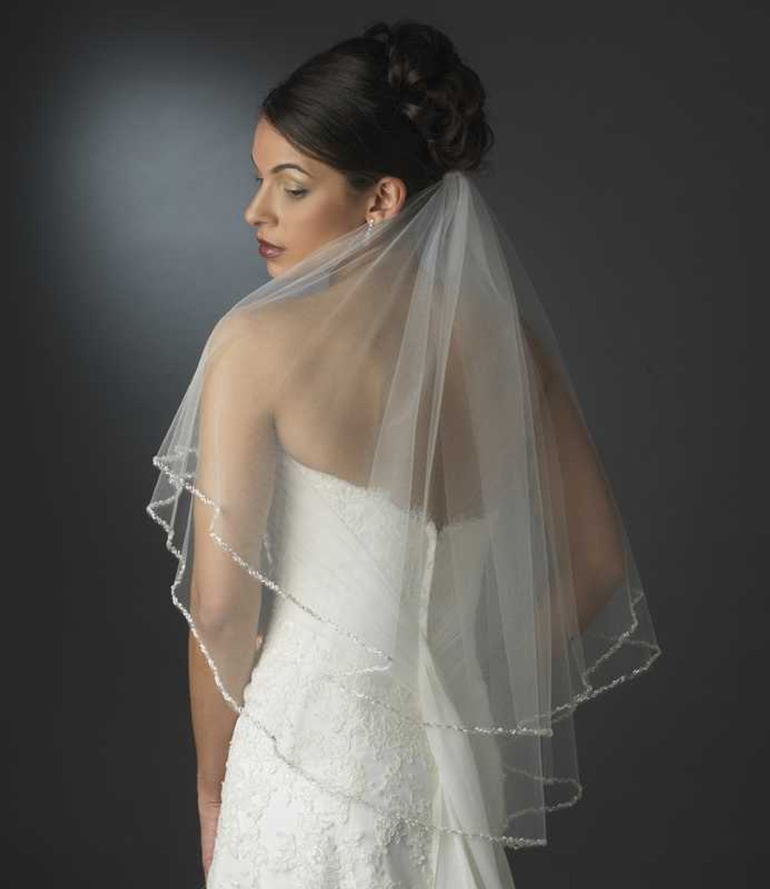 https://cdn11.bigcommerce.com/s-zb3qt33o/images/stencil/1280x1280/products/15373/60845/Two-Layer-Elbow-Length-Wedding-Veil-with-Beaded-Pearl-Edge_26341__03158.1689477712.jpg?c=2
