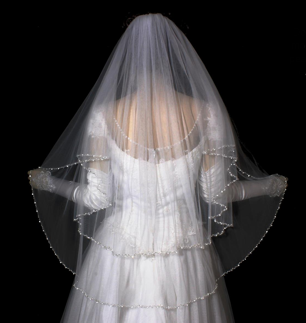 https://cdn11.bigcommerce.com/s-zb3qt33o/images/stencil/1280x1280/products/17237/60879/Two-Layer-Pearl-and-Crystal-Beaded-Fingertip-Length-Wedding-Veil_34319__48656.1689517178.png?c=2
