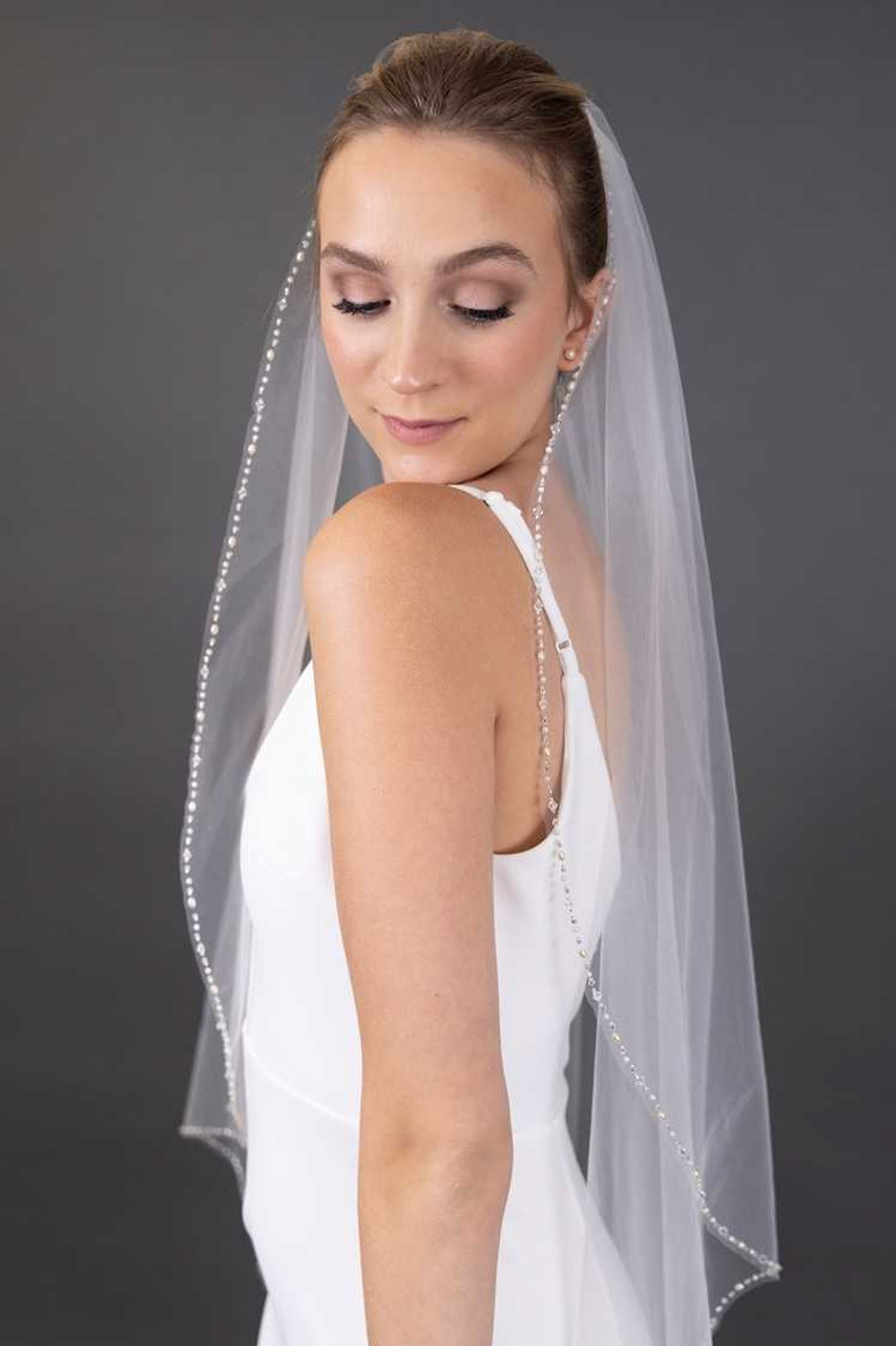https://cdn11.bigcommerce.com/s-zb3qt33o/images/stencil/1280x1280/products/19756/57753/Freshwater-Pearl-and-Crystal-Beaded-Edge-Waltz-Length-Wedding-Veil_53904__62053.1688502707.jpg?c=2