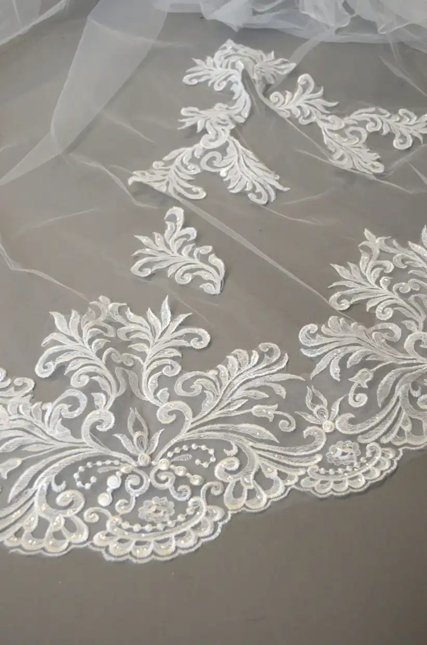 https://cdn11.bigcommerce.com/s-zb3qt33o/images/stencil/1280x1280/products/19960/62689/Scroll-Lace-Cathedral-Wedding-Veil-in-White-or-Ivory-E1343_62534__35633.1694533460.jpg?c=2