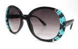 Oversized round UV bifocal sunglass readers with teal color faux snake skin fabric adhered left and right of the front of the frame for a high fashion look