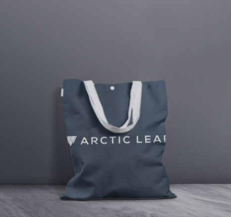 Arctic Leaf tote bag with grey wall background.