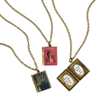 Literary Women Book Locket Necklace—Now You Can Display Your Literary Love for a Treasured Tome with Your Choice of Three Lockets Featuring Books Written by Iconic Female Authors