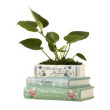 Novel Garden Planter—Your Love For Literature And Gardening Combines With This Ceramic Planter That Resembles A Pile Of Iconic Titles