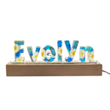 Flystar Crafts Personalized Epoxy Flower Letter Lamp—These Handmade Resin Lamps Make a Warm Edition to Any Bedroom in True Botanical Fashion