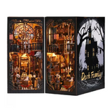 The Dark Family DIY Book Nook Kit—A Nook Full of Eerie Yet Adorable Details: With Little Bats Flying Around, Coffin-Shaped Bookcases, a Mysterious Black Cat, and Also a Cute Fellow Locked in a Cage