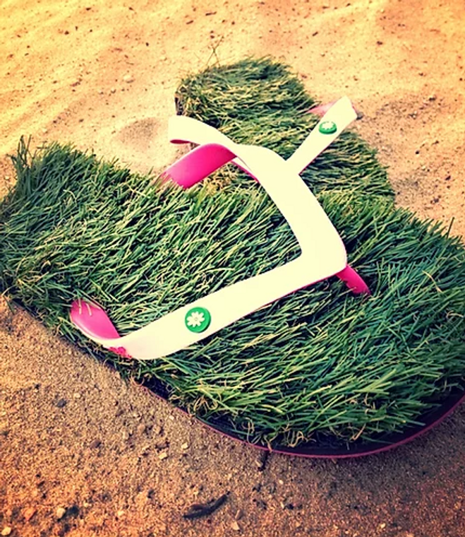 White/pink grass flip flops