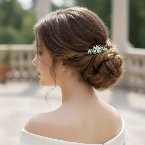 Ophelia Crystal Flower Hair Comb worn in hair: back three-quarter view of a person with brown hair in a low chignon