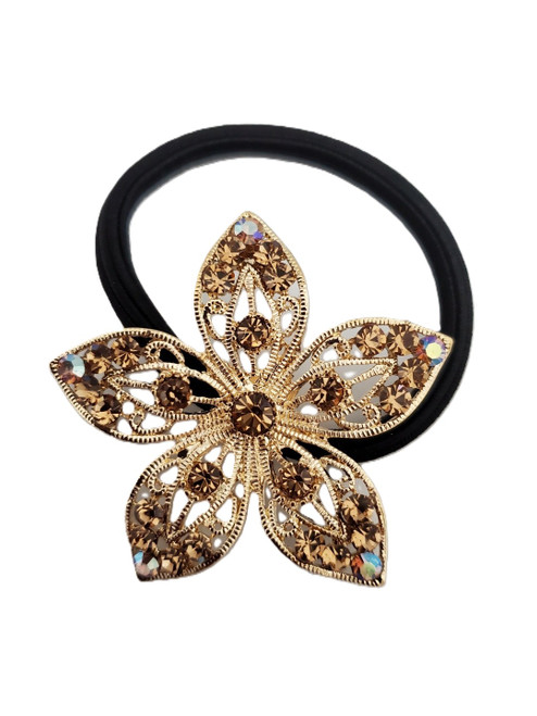 Aurelia Bloom Crystal Hair Tie: gold/champagne crystals on a silver-tone flower with black elastic