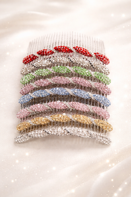Celeste Twist Crystal Hair Comb: seven of the colours stacked on pale satin: red, silver, green, blue, pink, gold and clear