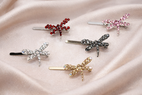 Auréline Dragonfly Crystal Magnetic Barrette: five of the colours on pink satin: red, pink, clear, dark grey and champagne